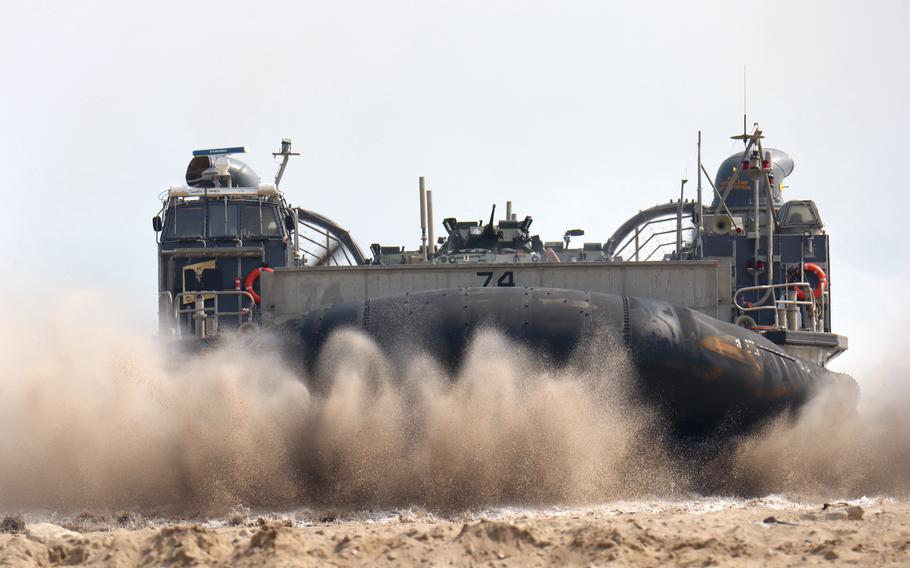 A U.S. Navy landing craft carrying light armored vehicles makes landfall during the Ssangyong Exercise in Pohang, South Korea, March 29, 2023. 