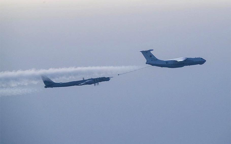 A Russian Tu-95 Bear, left, and a Il-78 Midas tanker fly over the Barents Sea on Feb. 3, 2022, according to NATO.  A quick reaction alert was launched to intercept and identify the Russian aircraft after they flew close to NATO air space without filing flight plans, NATO Air Command said. A Norwegian P-3 Orion identified the aircraft. 