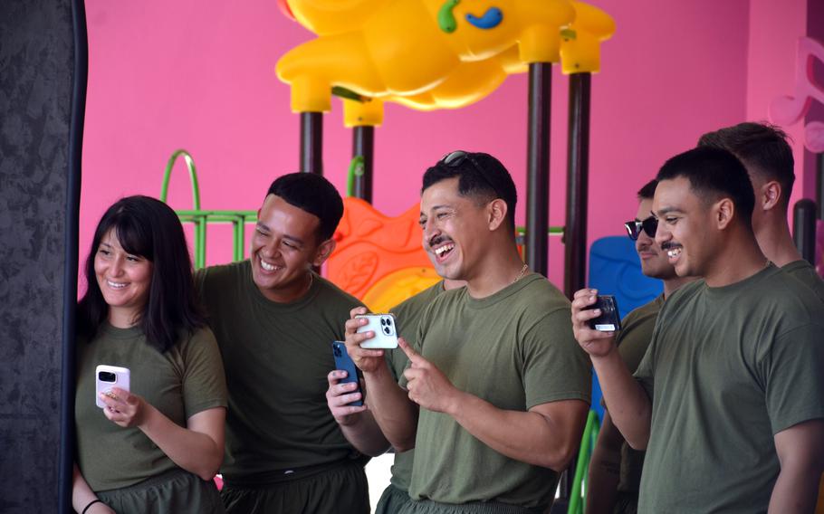 Members of the 15th Marine Expeditionary Unit enjoy a dance routine at the Martin Brands Childcare center in Pattaya, Thailand, March 6, 2024. 
