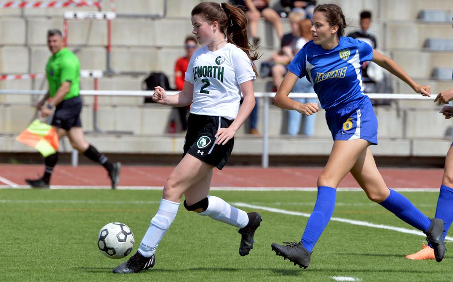 AFNORTH’s Finja Liebig gets away from Sigonella’s Anabel Vaiciulis n the girls Division III final at the DODEA-Europe soccer championships in Kaiserslautern, Germany, Thursday, May 19, 2022. Sigonella beat the Lions 3-1.