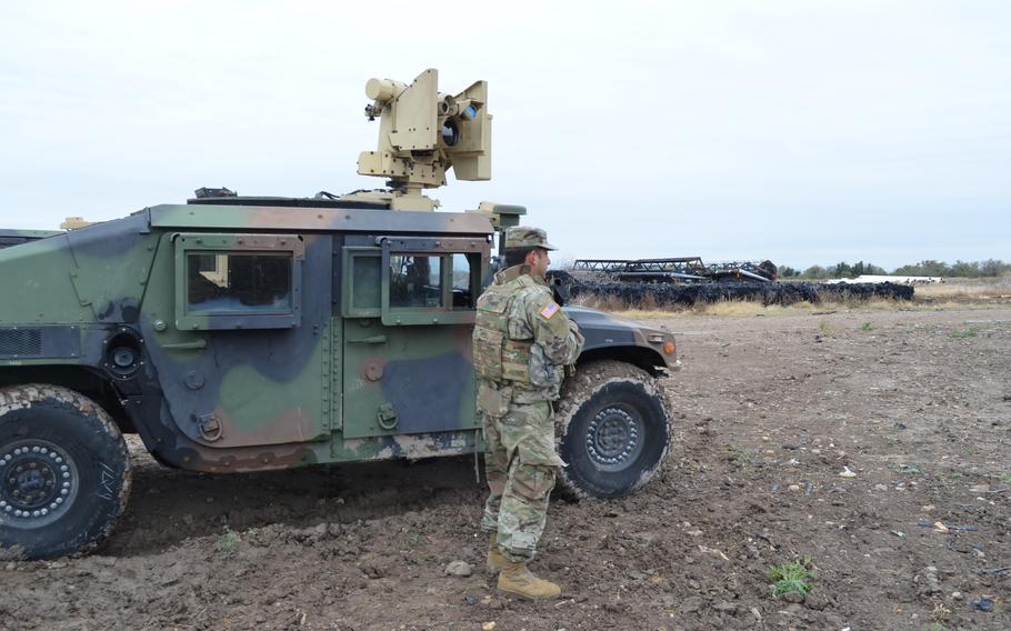 A member of the Texas National Guard stands watch in Starr County, Texas, on Jan. 21, 2022, as part of Operation Lone Star. The state mission has led to requests that the Department of Justice review the legality of the state conducting border security. 
