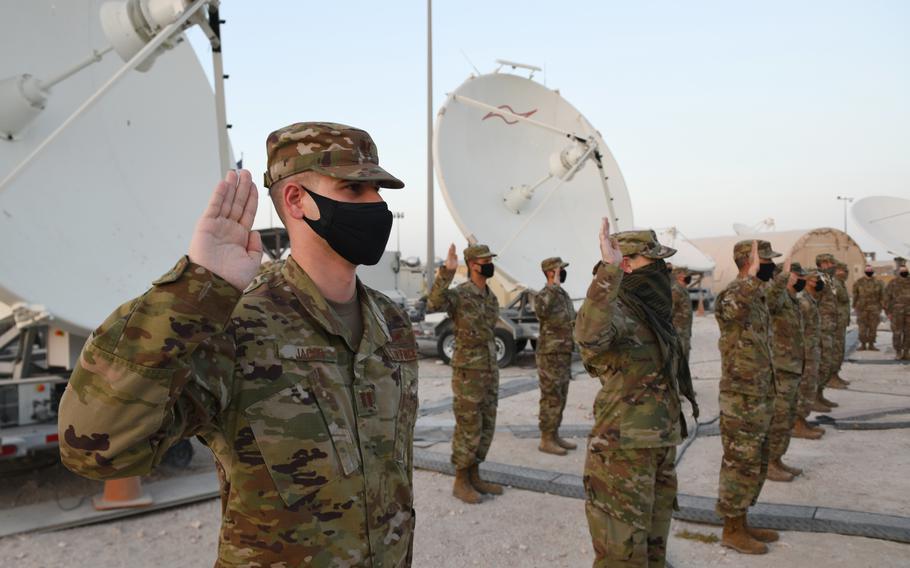 U.S. Air Force company grade officers raise their hands during their oath of office ceremony as they transferred into the Space Force on Sept. 1, 2020. The Space Force is the United States' newest service in more than 70 years. (U.S. Air Force photo by Staff Sgt. Kayla White)