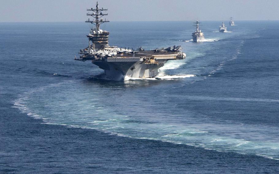 The Dwight D. Eisenhower Carrier Strike Group transits the Strait of Hormuz, Nov. 26, 2023. Helicopters assigned to the strike group sank three boats operated by Houthi militants who were firing on a civilian cargo ship.