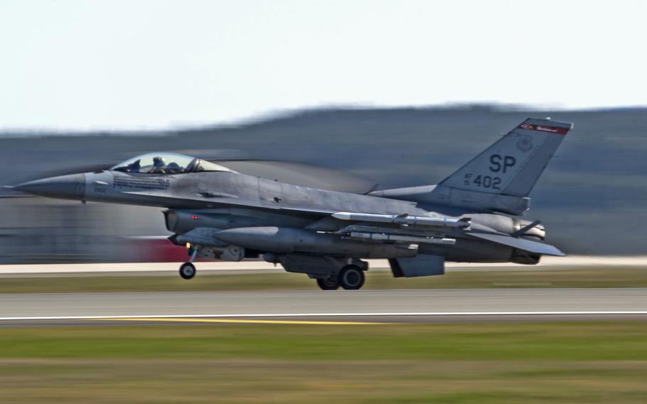 A U.S. Air Force F-16 Fighting Falcon lands at Spangdahlem Air Base, Germany in 2020.  Maj. Brady Augustin landed an F-16 on its belly during a  March 2022 incident where the plane lost its left main landing wheel. Augustin received the 2022 Koren Kolligian Jr. Trophy for his efforts, during a ceremony at the Pentagon on Feb. 7, 2024. 