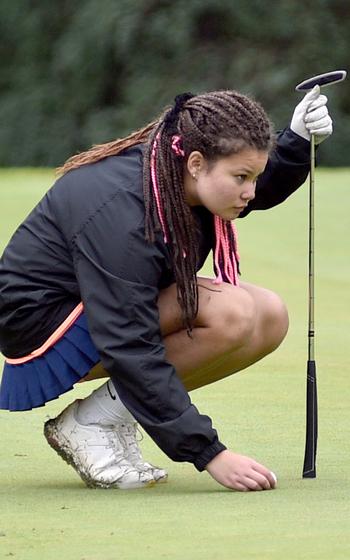 Taylor Kreimeier of Stuttgart places her ball down on the No. 6 green Wednesday during the first day of the DODEA European golf championships at the Rheinblick Golf Course in Wiesbaden, Germany.