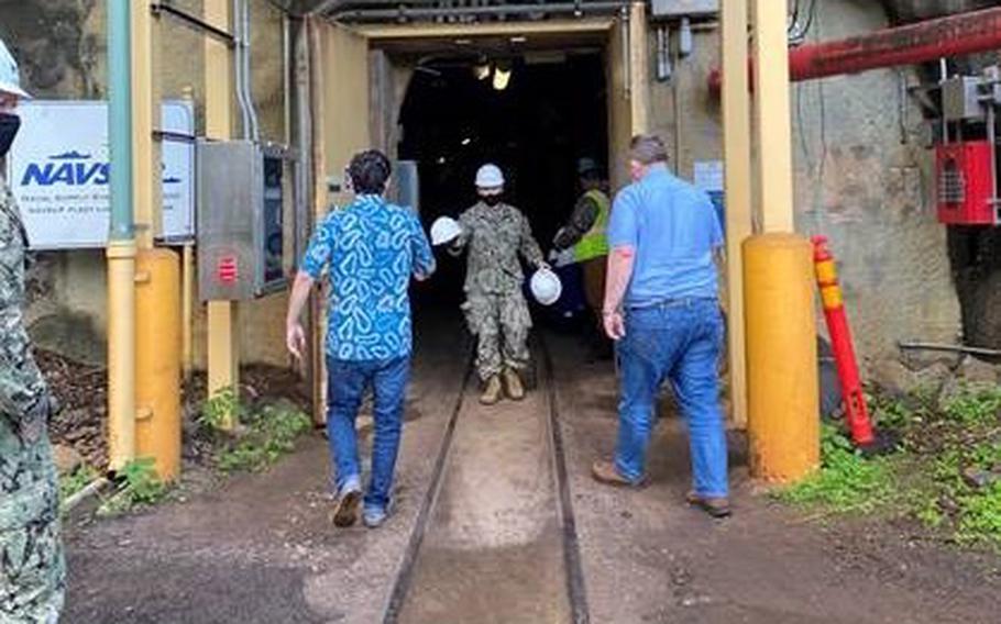 Hawaii Sen. Brian Schatz, left, and Montana Sen. Jon Tester, begin a tour of the Red Hill fuel storage facility near Joint Base Pearl Harbor-Hickam, Hawaii, Jan. 25, 2022.