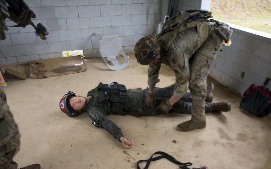 A U.S. soldier searches a mock insurgent during an Ulchi Freedom Shield drill in Paju, South Korea, Wednesday, Aug. 23, 2023. 