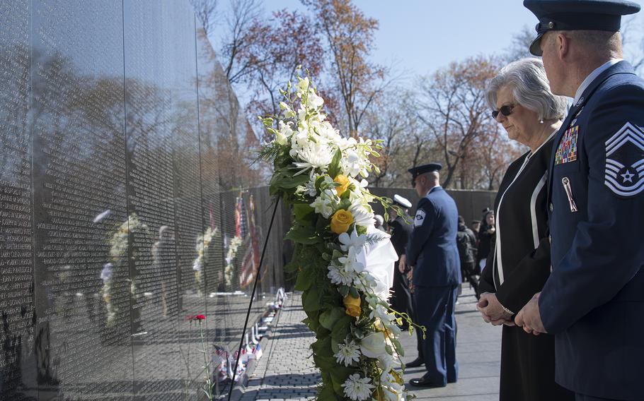 Gold Star daughter Kathy Webb and Chief Master Sgt. Michael Cornitius, representingf the National Guard Bureau attend a wreath laying ceremony at the Vietnam Veterans Memorial wall in Washington, D.C., on Wednesday, March 29, 2023, to commemorate National Vietnam War Veterans Day.