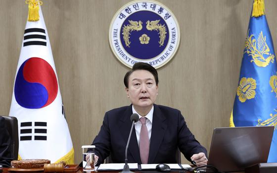 South Korean President Yoon Suk Yeol speaks during a Cabinet meeting at the president office in Seoul, South Korea, Tuesday, March 21, 2023.  President Yoon said Tuesday his government will take steps to restore Japan’s preferential trade status as he's trying to push for his contentious bid to resolve fraught ties with Japan despite domestic opposition.