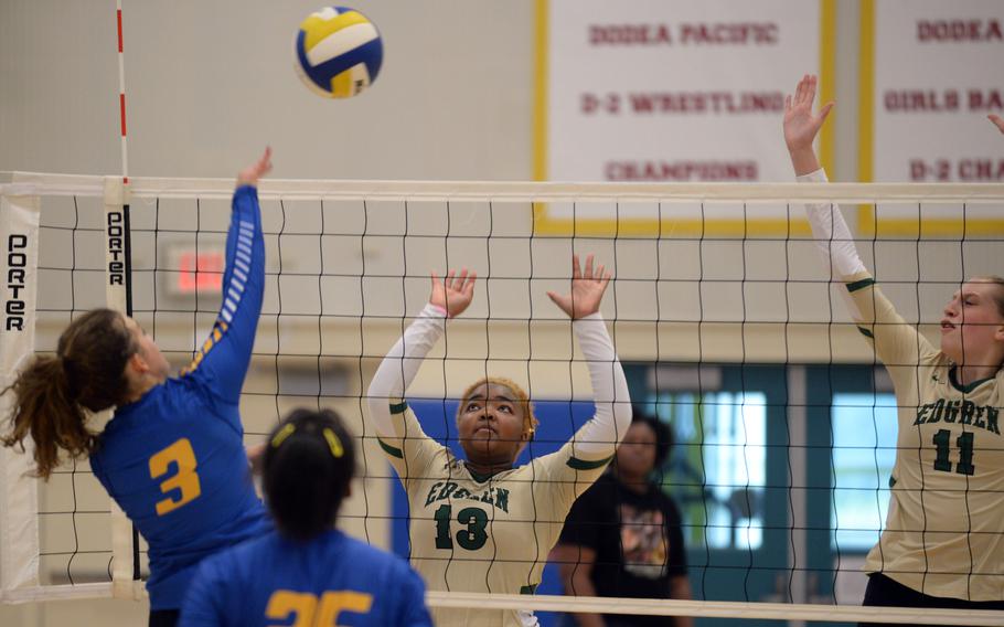 Yokota's Lilly Wellons spikes against Robert D. Edgren's Genesis Miller and Kaitlyn Willets during Saturday's DODEA-Japan volleyball match. The Panthers won in five sets, splitting their weekend series with the Eagles.
