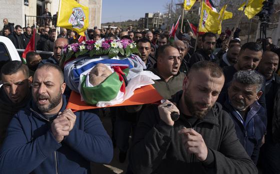 FILE - Mourners carry the body of Omar Assad, during his funeral in the West Bank village of Jiljiliya, north of Ramallah, Thursday, Jan. 13, 2022. Israeli leaders on Sunday, April 21, 2024, harshly criticized an expected decision by the U.S. to impose sanctions on a unit of ultra-Orthodox soldiers in the Israeli military. The unit came under heavy American criticism in 2022 after the elderly Palestinian-American man was found dead shortly after he was detained at a West Bank checkpoint. (AP Photo/Nasser Nasser, File)