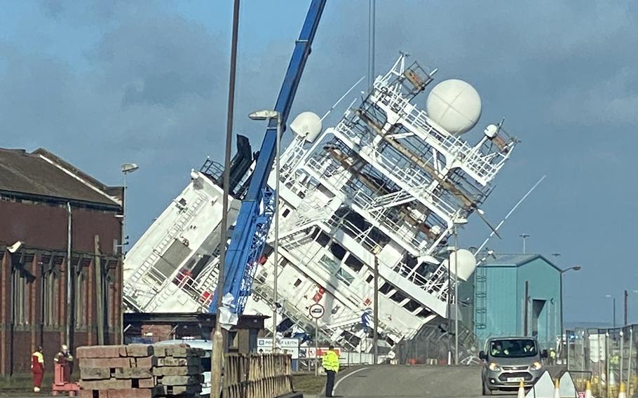 The Navy-owned Motor Vessel Petrel lists to the side in a dry dock in Scotland on March 22, 2023, in this image from social media.