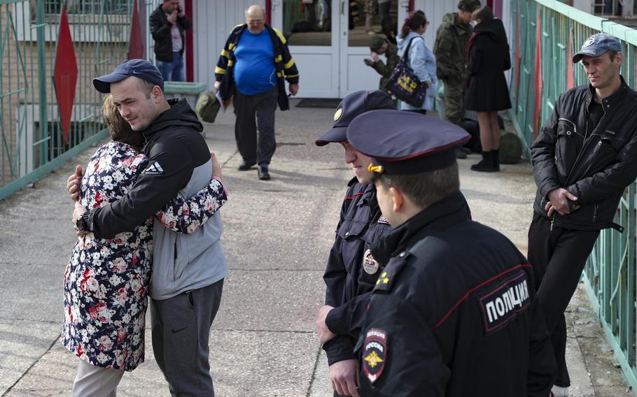 A Russian recruit hugs his mother at a military recruitment center in Volgograd, Russia, Saturday, Sept. 24, 2022. 