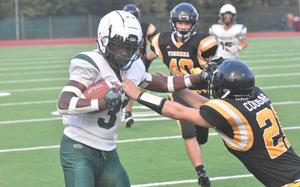 Naples' Robert Oliver, who rushed for a game-high 75 yards, stiff arms a Vicenza defender in the Wildcats' 40-0 victory over the Cougars on Friday, Sept. 22, 2023.