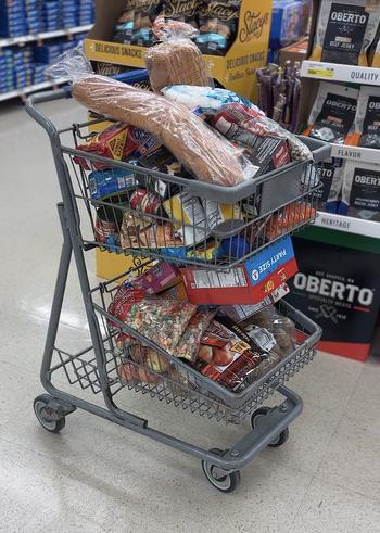 A cartload of groceries recently purchased by Ashley Gutermuth, who along with another military spouse, Heather Campbell, is helping to feed military families experiencing food insecurity. Gutermuth estimates she has spent more than $600 buying basics, such as oatmeal, bread and bananas for about 10 families.