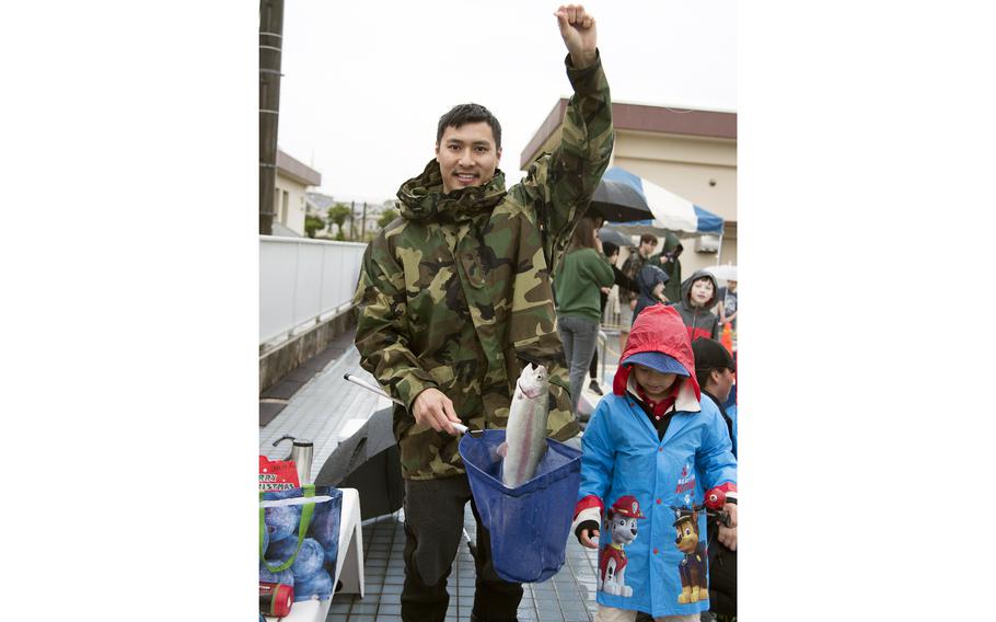 Nicholas Trans hauled in the first rainbow trout of the inaugural Sakana Trout Fishing Derby at Yokota Air Base, Japan, April 15, 2023.