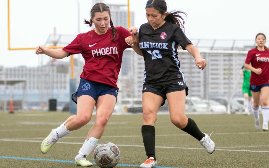 Elle Ono and Biance Duerkop battle for the ball.