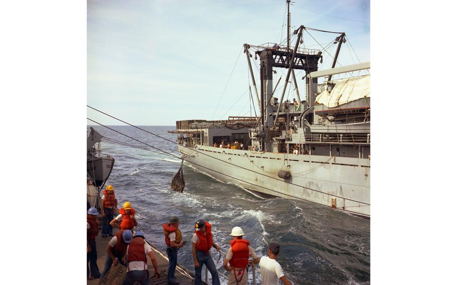 Equipment and ammunition are hoisted aboard the USS Buchanan destroyer from the USS Haleakala (AE-25) during resupply operations on July 15, 1968. 
