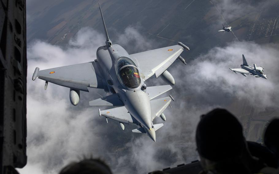 Eurofighter Typhoon military fighter jets flying. 
