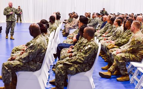 Master Chief Petty Officer of the Navy James Honea addresses sailors and Marines on April 16, 2025, during an all-hands call in Manama, Bahrain. He spoke about recruiting, military construction and veterans affairs, and answered audience questions.