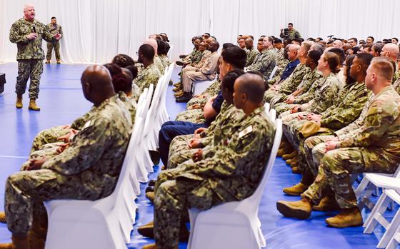 Master Chief Petty Officer of the Navy James Honea addresses sailors and Marines on April 16, 2025, during an all-hands call in Manama, Bahrain. He spoke about recruiting, military construction and veterans affairs, and answered audience questions.