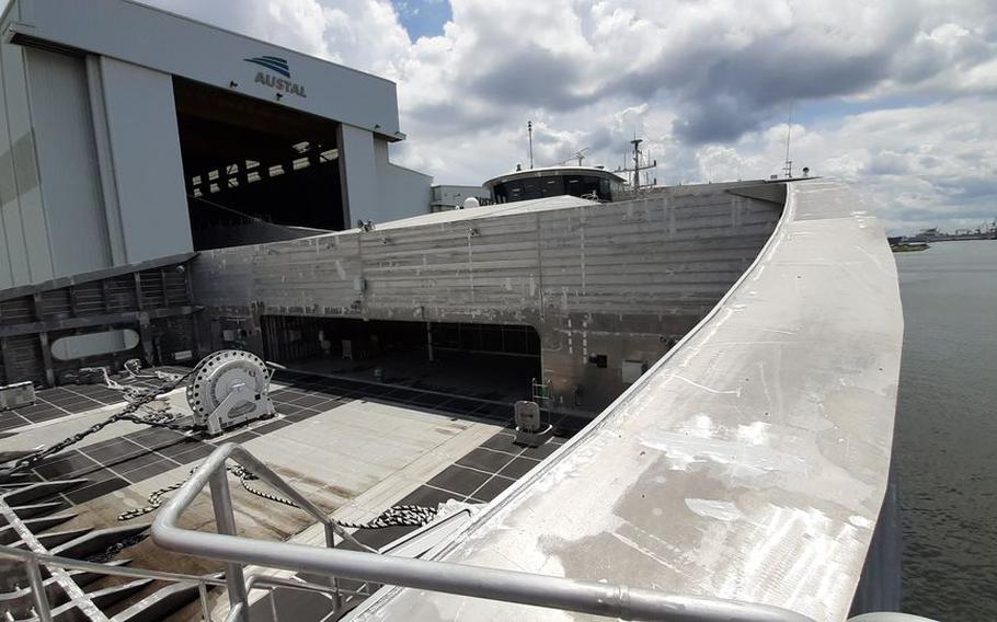 The bridge of EPF 12, the future USNS Newport, is seen from the bow of the ship as it is docked alongside Austal USA's shipyard in Mobile, Ala.