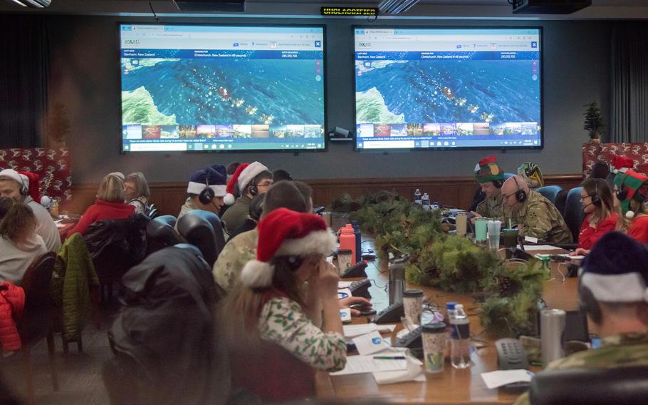 Volunteers answer calls at the 2019 NORAD Tracks Santa operations center at Peterson Space Force Base in Colorado.