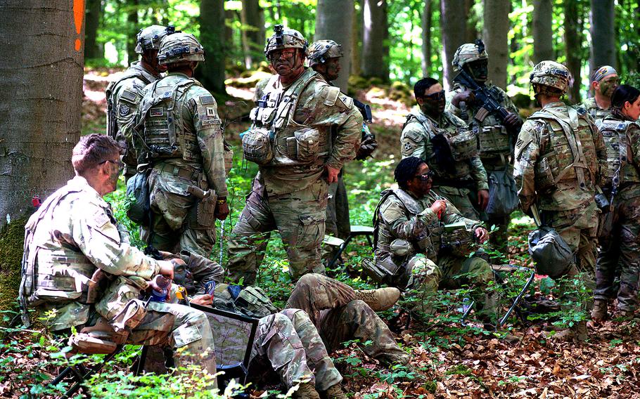 Soldiers gather for a tactical planning session