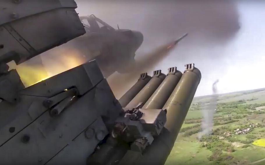 A Russian KA-52 helicopter gunship fires rockets on a mission at an undisclosed location in Ukraine, as seen in an image released on June 18, 2022.