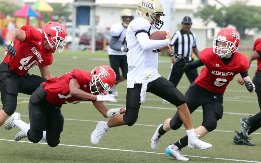 Humphreys quarterback Bradley Miller is surrounded by a sea of Nile C. Kinnick defenders.