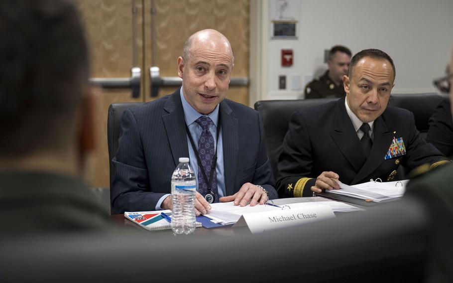 Deputy Assistant Secretary of Defense for China, Taiwan and Mongolia Michael Chase, center, hosts Chinese delegates at the Pentagon in Arlington, Va., Jan. 9, 2024.