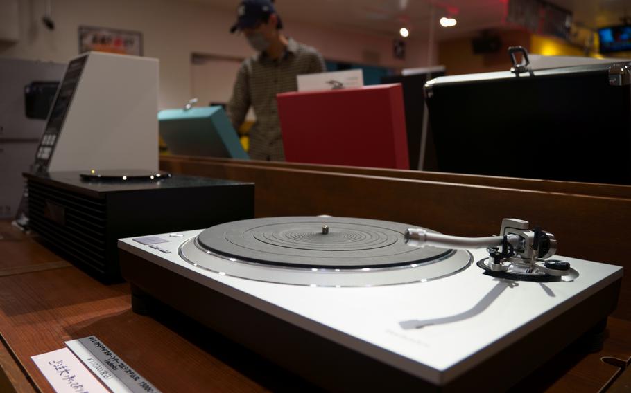 A vinyl lover browses on the sixth floor of Tower Records in Shibuya, Tokyo, Monday, May 2, 2022.