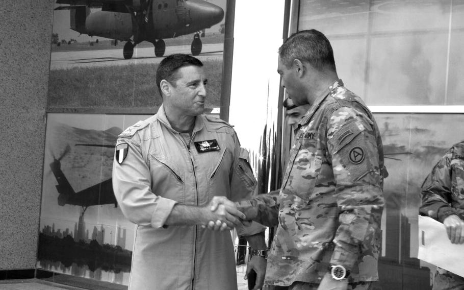 Stephen Toumajan, left, then head of the UAE's Joint Aviation Command, shakes hands with Michael X. Garrett, then commanding general of U.S. Army Central, in the UAE in March 2016. Toumajan is a retired U.S. Army lieutenant colonel.