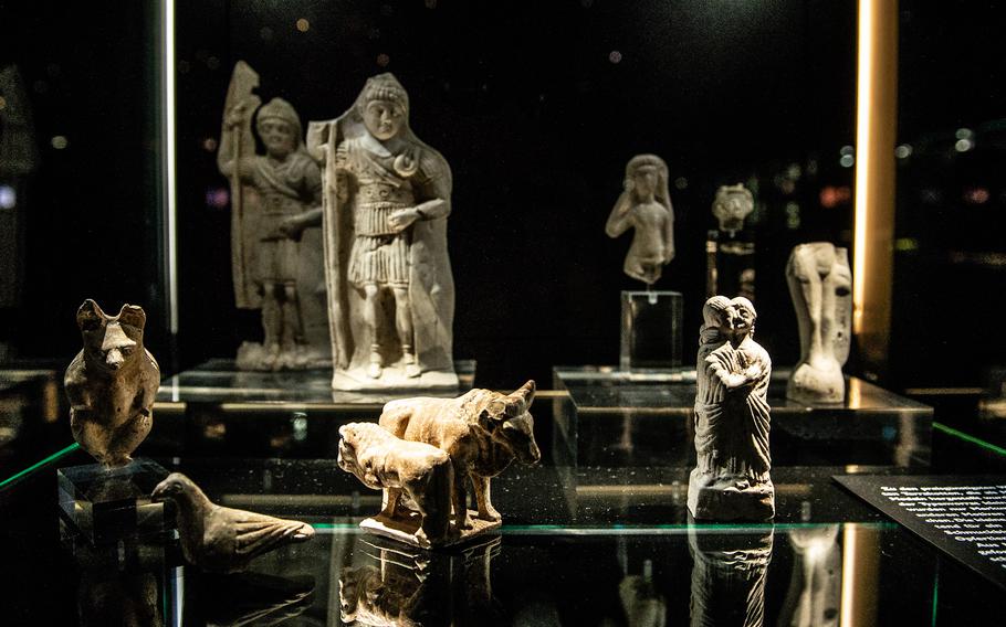 Small statues are on display at the Isis and Mater Magna shrine in Mainz, Germany, on Nov. 10, 2022. The artifacts were found during archaeological digs after the temple was discovered in the early 2000s. Experts believe they were sold and offered at the temple as tributes to Roman deities.
