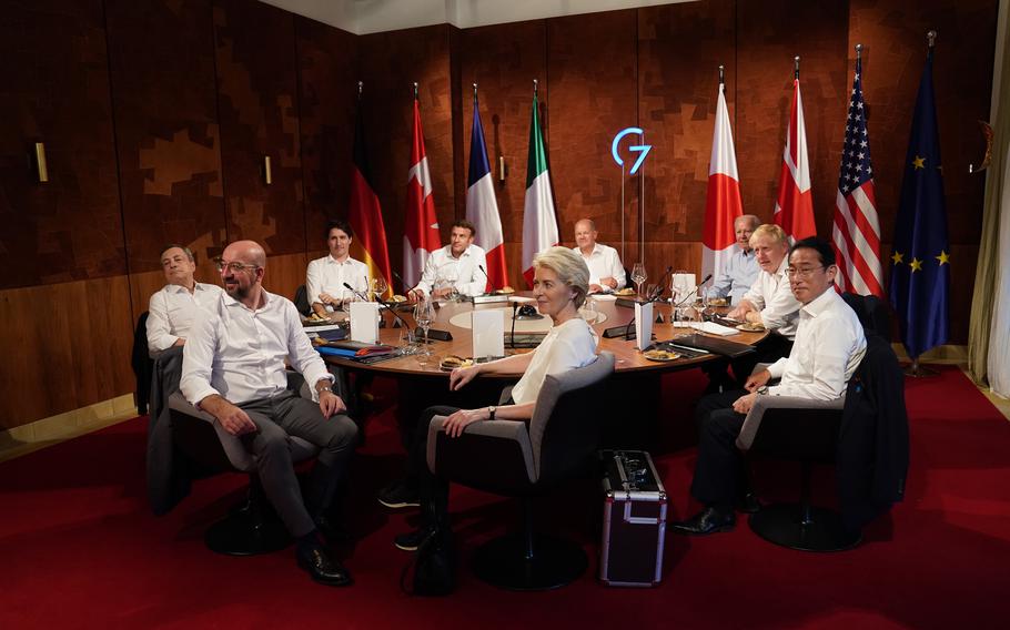 G7 leaders, (clockwise from front) European Union Council Commission President Ursula von der Leyen, European Union Council President Charles Michel, Prime Minister of Italy Mario Draghi, Prime Minister of Canada Justin Trudeau,  French President Emanuel Macron, German Chancellor Olaf Scholz, U.S. President Joe Biden, Prime Minister Boris Johnson and Prime Minister of Japan Fumio Kishida, at a working session dinner during the G7 summit in Schloss Elmau, on June 26, 2022 near Garmisch-Partenkirchen, Germany.