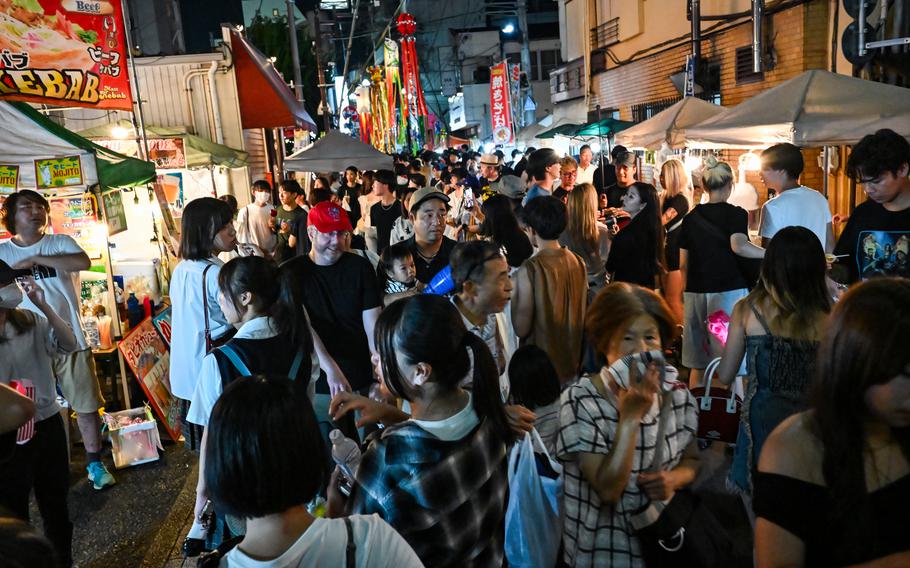 Festival goers jam the  streets of Fussa, Japan.