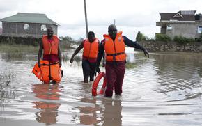 Kenyan Red Cross personnel and volunteers conduct search and rescue missions, around houses submerged by flood water in Machakos county, Kenya Monday, April 22, 2024. Heavy rains pounding different parts of Kenya have led to the deaths of at least 13 people and displaced some 15,000, the United Nations said, as forecasters warned more rains can be expected until June. (AP Photo/Brian Inganga)