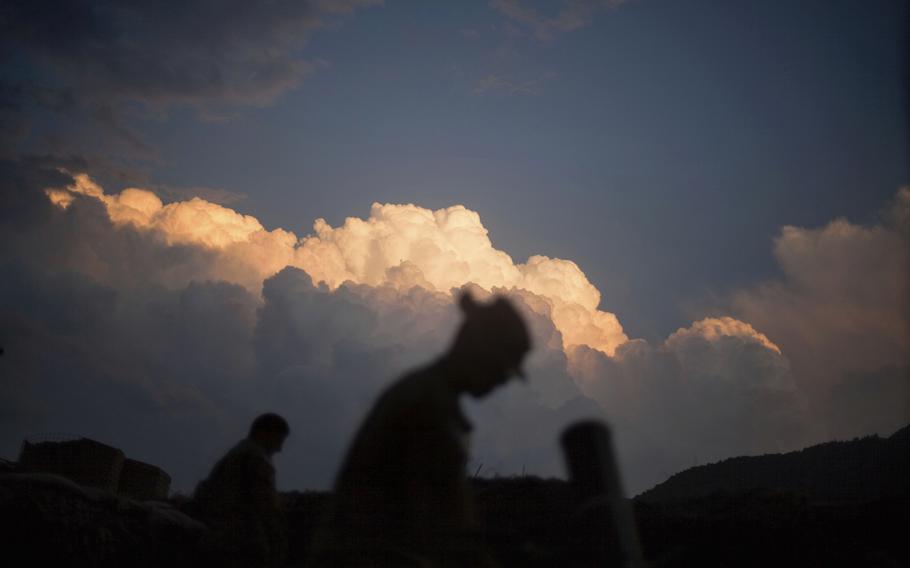 U.S. soldiers prepare the mortar pit in Kunar province, Afghanistan, Sept. 15, 2011. 