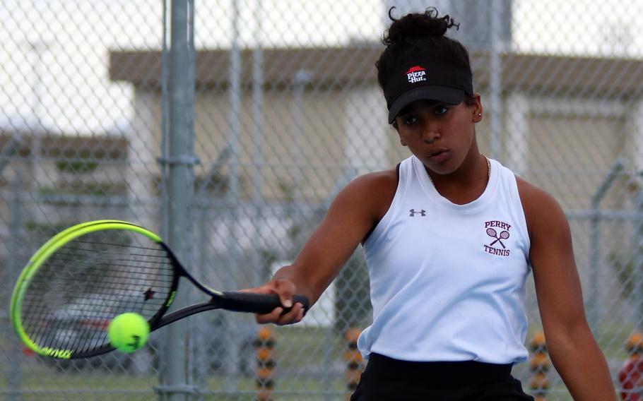 Matthew C. Perry's Ivanelis Nieves-Bermudez hits a forehand against E.J. King during Friday's DODEA-Japan tennis matches. Nieves-Bermudez won her singles match 8-0 over Joanna Hall and teamed with Aiana Bulan to beat Hall and Kana Fisher in doubles 8-1.