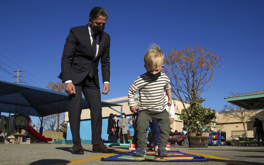 Los Angeles Unified School District Superintendent Alberto M. Carvalho watches 3-year-old Julian Elwell play hopscotch during a visit to Fair Avenue Early Education Center on Thursday, Feb. 17, 2022, in North Hollywood, Calif.