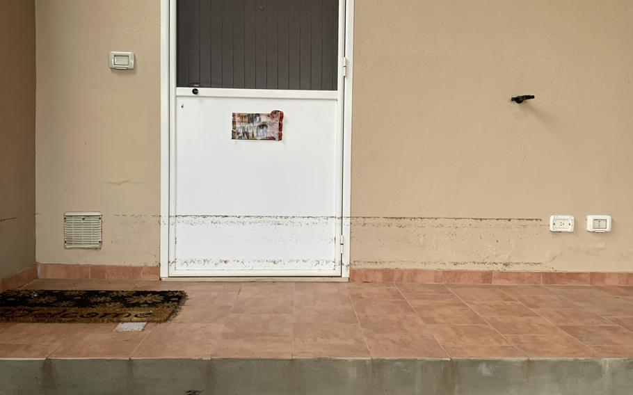 A watermark line is visible on the exterior wall of a home in the Marinai housing complex at Naval Air Station Sigonella in Sicily, Oct. 29, 2021. Torrential rains earlier in the week caused flooding on the base. About 92 people were displaced, being moved into empty residences in the complex or hotels in the area.