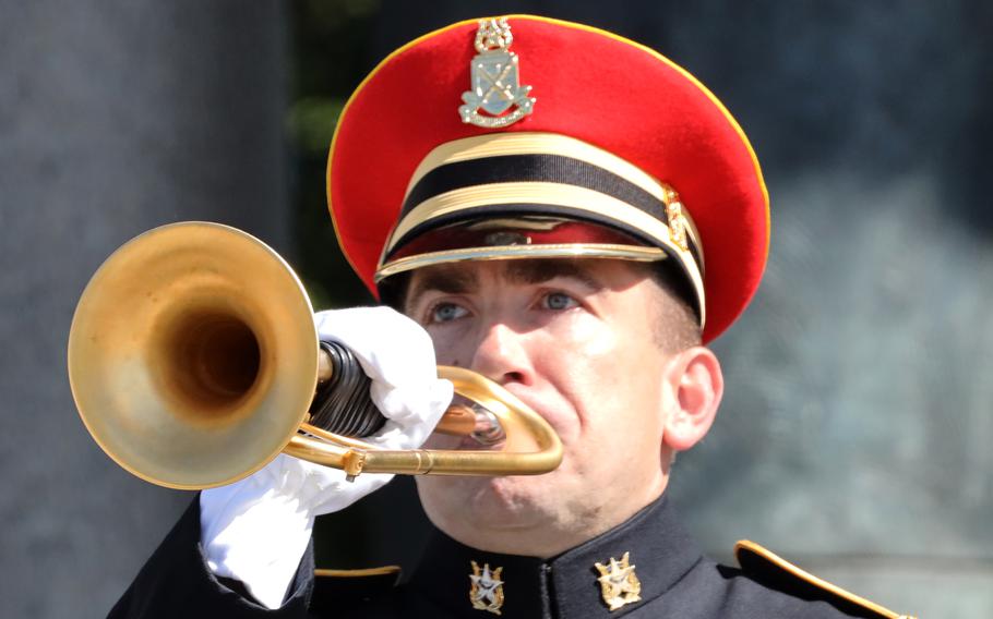 A bugler plays taps during a Memorial Day ceremony at the National World War II Memorial in Washington, D.C., May 31, 2021.