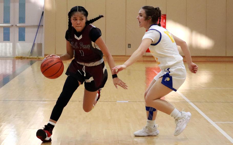 Elieza Cuaco dribbles towards the basket.
