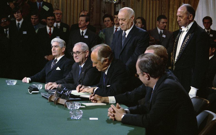 Secretary of State William Rogers signs the ceasefire and peace agreement ending U.S. involvement in the Vietnam War on Jan. 27, 1973. 