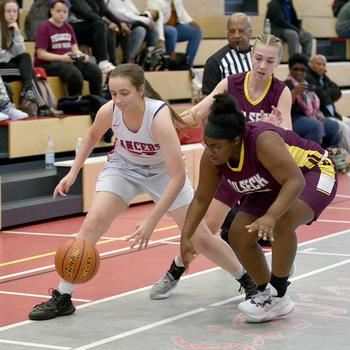 Lakenheath's Eden Wheeler, left, and Vilseck's Scottlyn Smithson go after a ball during a game at Kaiserslautern High School on Saturday in Kaiserslautern, Germany. In back is the Falcons' Kaila Haynes.