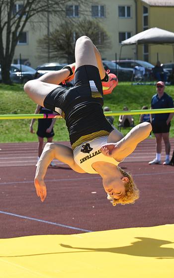Dane Westberry, a freshman at Stuttgart, flips upside down while participating in the high jump during the Ansbach Invitational track meet at Ansbach Middle High School, Germany, on Saturday, April 6, 2024.