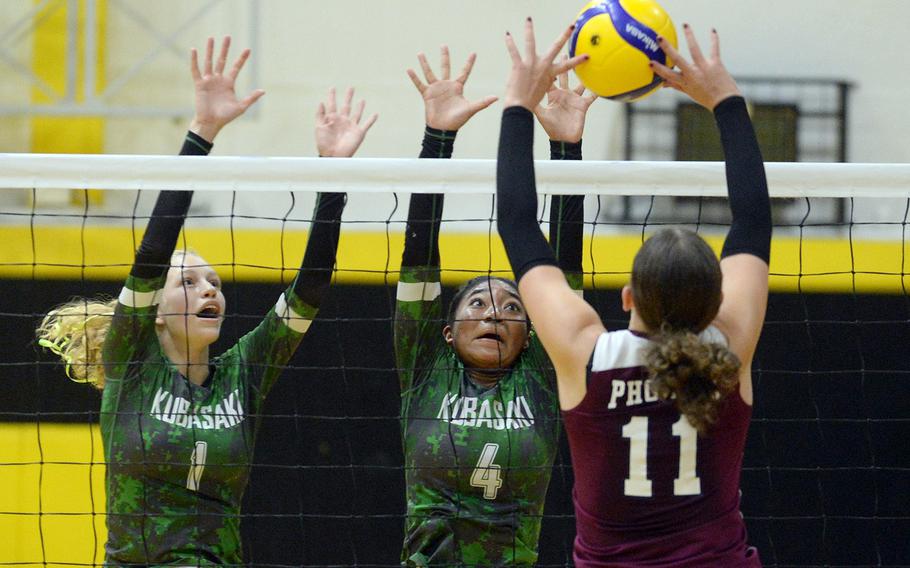 Kubasaki's Emma Leggio and Risha McGriff go up to contest a shot by Seisen's Ariana Hill.