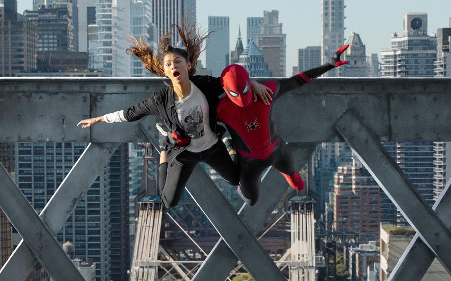 MJ (Zendaya) and Spider-Man (Tom Holland) jump off a bridge in “Spider-Man: No Way Home,” now playing in many on-base theaters.