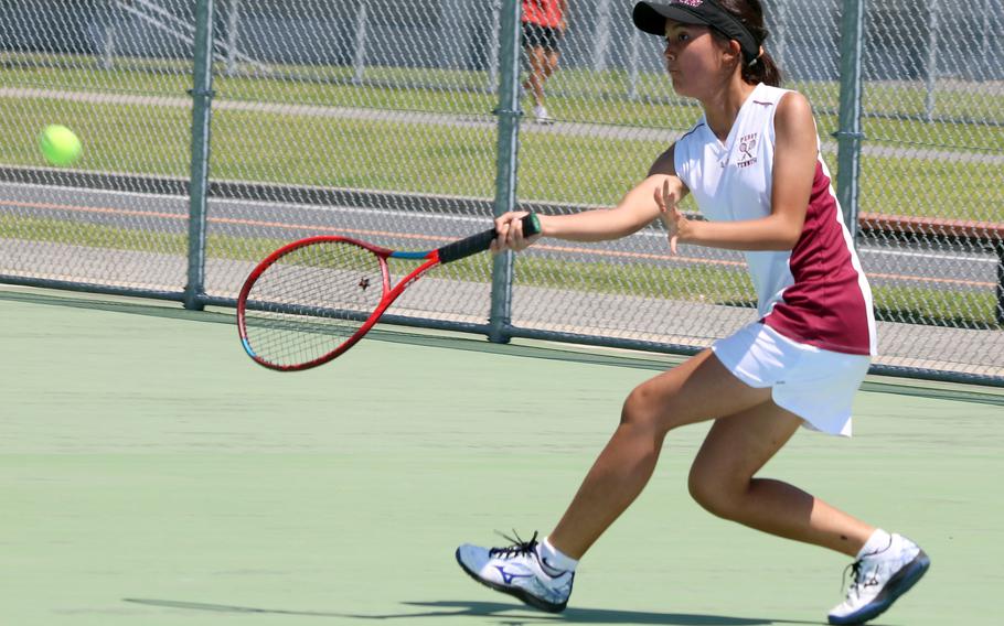 Matthew C. Perry's Nina Altig hits a return during her 8-4 loss Saturday to E.J. King's Moa Best.