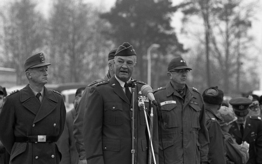 Gen. Howell M. Estes Jr., commander of the Military Airlift Command, addresses the arriving troops, with German Lt. Gen. K.W. Thilo, Lt. Gen. Donald V. Bennett and Maj. Gen. James T. McGibony behind him. 